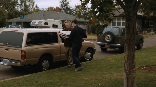 Ray, carrying paintings to a truck